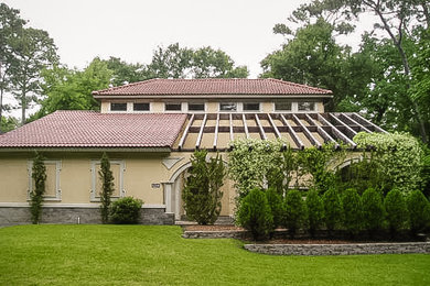 Example of a mid-sized classic home design design in Houston