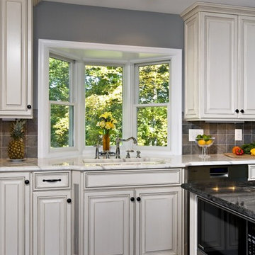 Dark Mahogany Wood Floor, Stone Wall, Bench Seat Bring Kitchen to Life