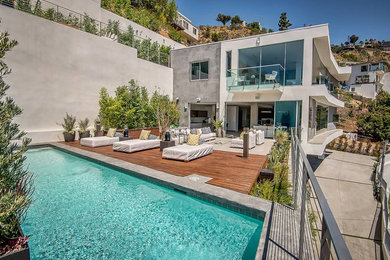 Inspiration for a huge modern backyard patio container garden remodel in Los Angeles with decking and no cover