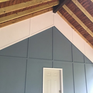 Screened porch featuring Eze Breeze windows and exposed rafters.