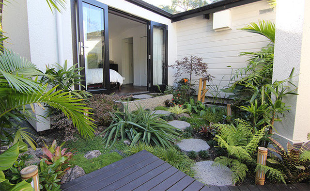 Tropical  by Zones Landscaping Specialists