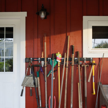 Organized Garden Tools on Red Barn Wall at Rosemound Farm, Oregon
