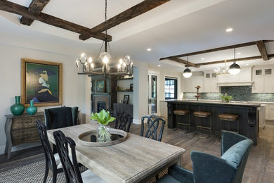 Dining room - large transitional medium tone wood floor and brown floor dining room idea in Minneapolis with gray walls, a two-sided fireplace and a brick fireplace