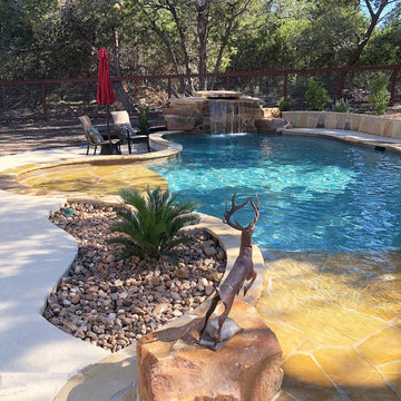 Freeform with Grotto, Beach Entry, and Flagstone Sun Shelf