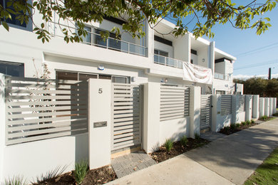 Design ideas for a two-storey white exterior in Perth.