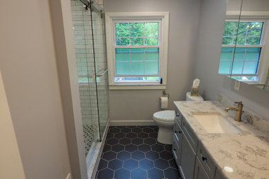 Inspiration for a mid-sized modern ceramic tile, black floor and double-sink bathroom remodel in Detroit with white cabinets, gray walls, marble countertops, white countertops and a built-in vanity