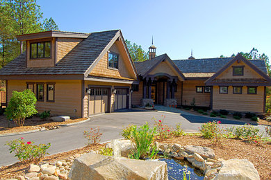 Example of a mid-sized transitional home design design in Denver