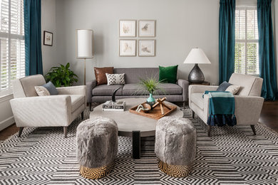 Example of a mid-sized trendy formal and open concept dark wood floor and brown floor living room design in Atlanta with gray walls and no tv
