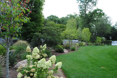 Design ideas for a large transitional backyard full sun garden in New York with a garden path and gravel.