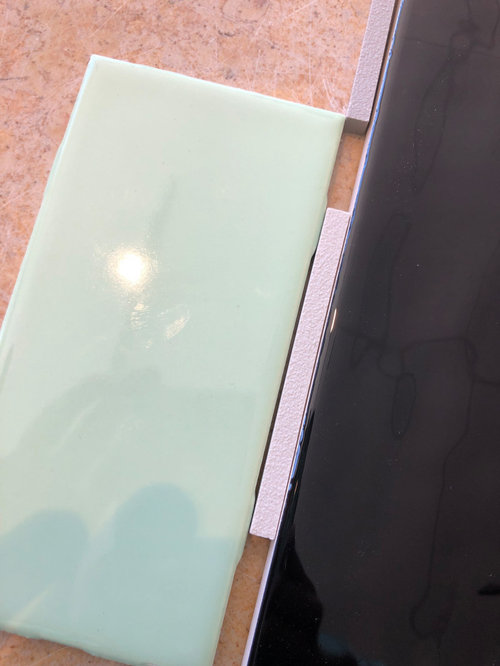 What color grout with mint green tile?