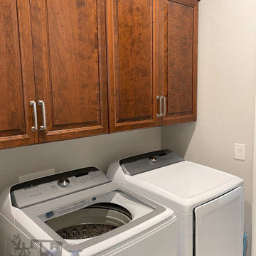 Traditional Laundry Room with Cherry Cabinetry