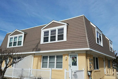 Example of a beach style home design design in Philadelphia