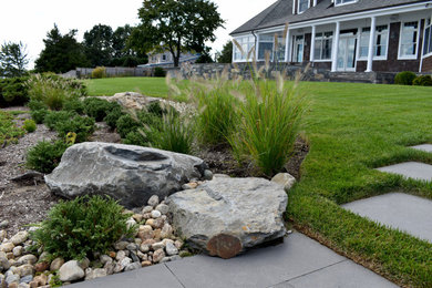 Inspiration for a large traditional drought-tolerant and full sun backyard stone walkway in Providence for summer.