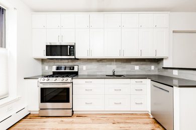 Mid-sized minimalist kitchen photo in New York