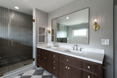 Large transitional master gray tile and ceramic tile porcelain tile, gray floor and double-sink corner shower photo in Chicago with beaded inset cabinets, brown cabinets, an undermount tub, gray walls, an undermount sink, quartzite countertops, a hinged shower door, white countertops, a niche and a freestanding vanity