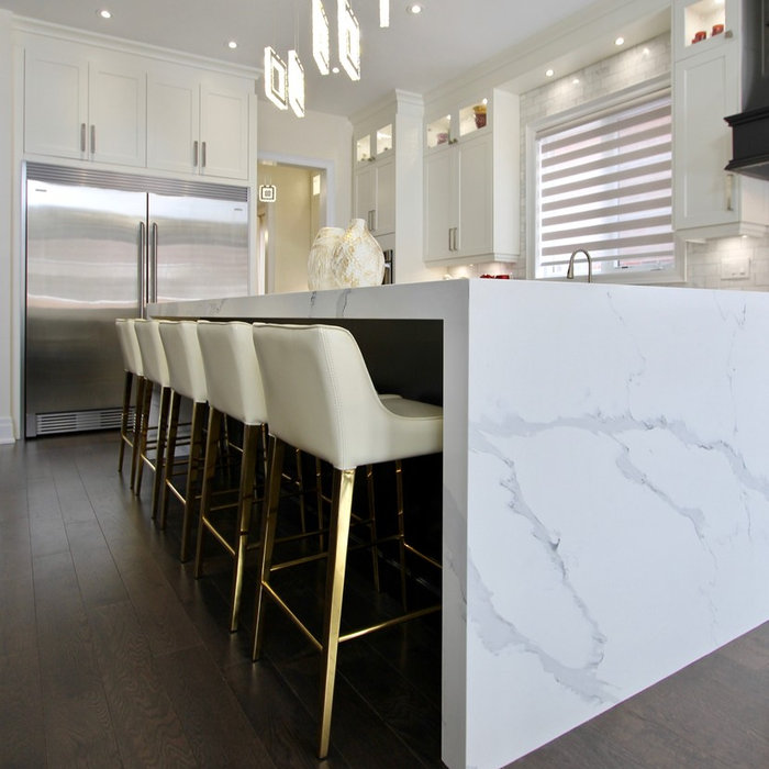 Example of a huge transitional l-shaped dark wood floor and brown floor open concept kitchen design in Toronto with an undermount sink, shaker cabinets, white cabinets, quartz countertops, white backs