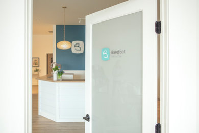 Example of a large minimalist entryway design in Burlington