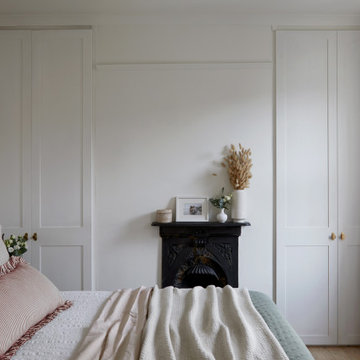 Serene Bedroom with Art-Inspired Soft Pink & Green Palette | Bedroom Design Idea