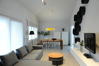 Inspiration for a mid-sized contemporary formal and enclosed ceramic tile living room remodel in Other with white walls, no fireplace and a wall-mounted tv