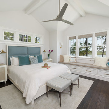 Vaulted ceiling gives light and drama to bedroom