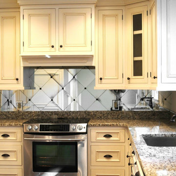 Traditional Kitchen with Cream Colored Cabinets and Mirror Backsplash