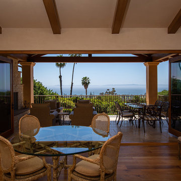 Folding Door Systems Create Open-Air Dining in a Spanish Style Home