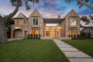 Inspiration for a timeless multicolored two-story stucco exterior home remodel in Dallas with a shingle roof and a gray roof