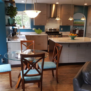 This is a two tone updated kitchen with efficient use of space & feature points
