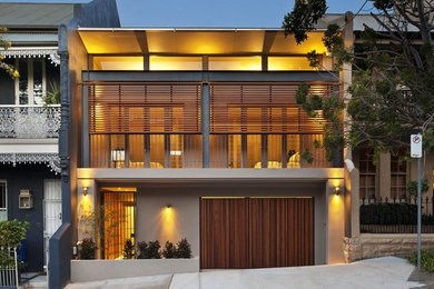 Inspiration for a mid-sized contemporary three-storey house exterior in Sydney with a metal roof.