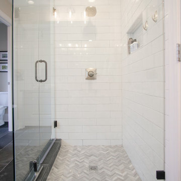 Curbless Walk-In Shwer with Chevron Tile Floor and Recessed Niche