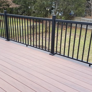 Deck with patio underneath and walkway. Note the 2 colors of PVC decking used.
