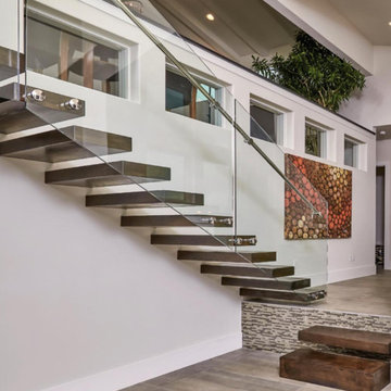 Floating iron stair with glass railings