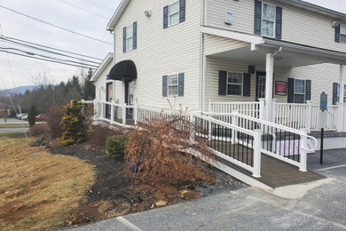 Deck - mid-sized traditional side yard second story mixed material railing deck idea in Other with no cover