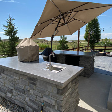 Rustic Reverie: Custom Concrete and Stone Unite in Your Outdoor Culinary Haven
