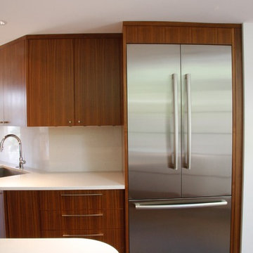 Walnut cabinetry and Bosch fridge