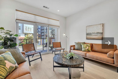 Example of a trendy light wood floor living room design in Philadelphia