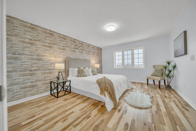 Example of a transitional bedroom design in Toronto