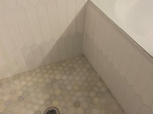 Bottom Row Of Ceramic Tiles Turning Gray, Shower Floor Tiles Turning White