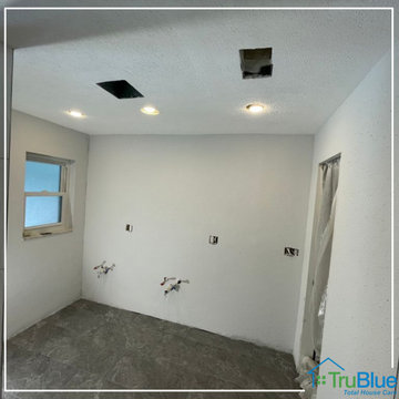 Repairs and painting on the drywall walls of a bathroom