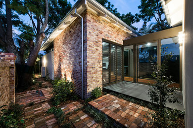 Inspiration for a front door in Perth with porcelain floors, a pivot front door and a glass front door.
