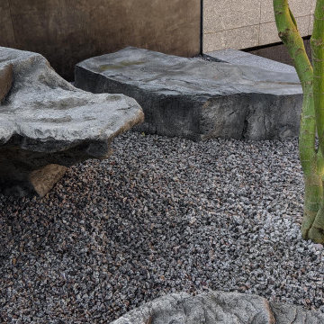 Contemporary Pond Garden - Large boulders.