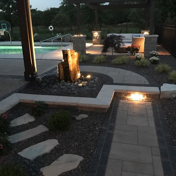 Versatile Outdoor Escape: Turf, Patio, Pergolas & Water Features