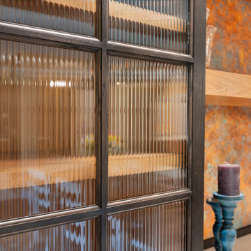 Close Up Reeded Glass Cabinet Door Black Wood Frame Copper Backsplash