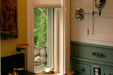 Mid-sized arts and crafts bathroom photo in Boston with recessed-panel cabinets, yellow walls, an undermount sink and soapstone countertops