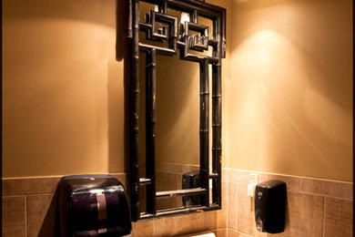 This is an example of an eclectic powder room in Other.
