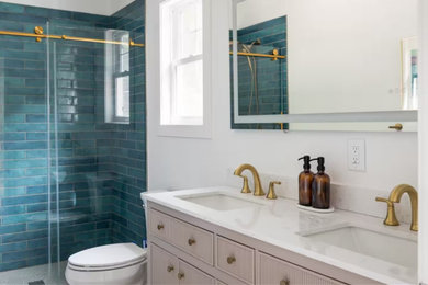 Beach style double-sink sliding shower door photo in Other with an undermount sink