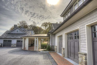 Example of a huge ornate detached three-car garage design in Philadelphia