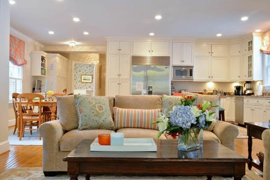 Family room - mid-sized transitional open concept light wood floor family room idea in DC Metro with beige walls, no fireplace and a wall-mounted tv