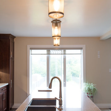 Falsetta - Brown Cabinets with Mosaic Tile Backsplash