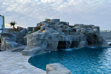 Example of an island style home design design in Phoenix